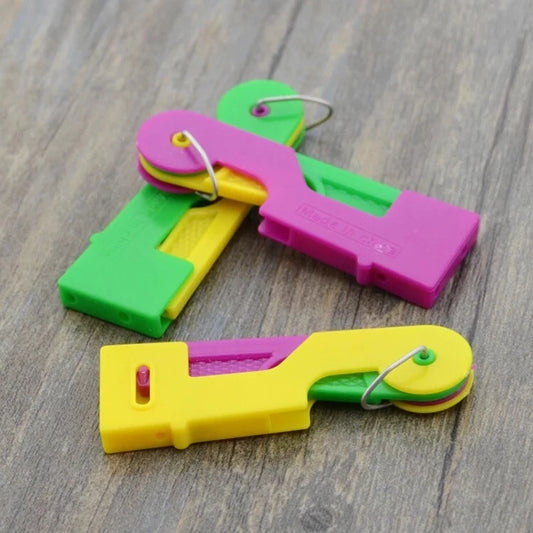 Hand using automatic needle threader for stitching