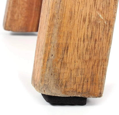 Black felt pads stick on bottom of furniture close detail