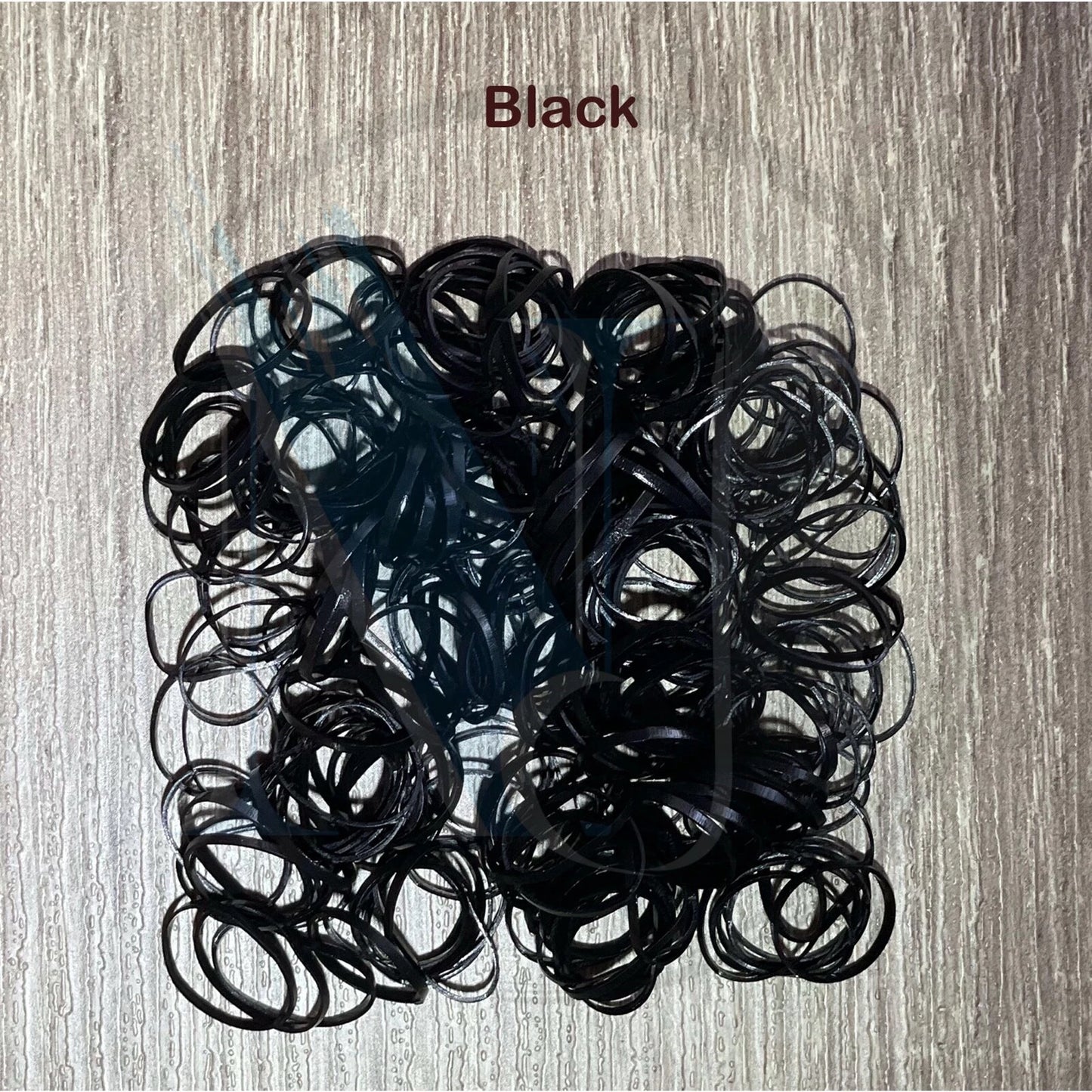 Black hair elastics used for braiding small hair sections