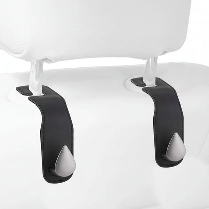 Car back seat organiser in use with multiple hanging items