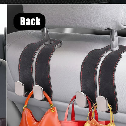 Car headrest hook storing small items like keys and bags