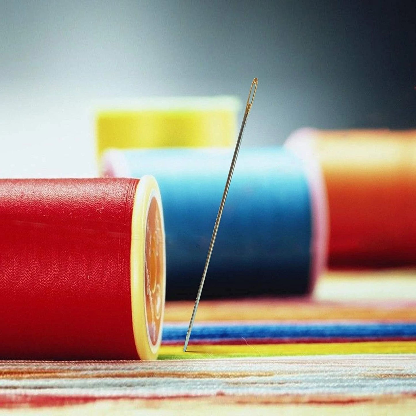 Embroidery needle gliding smoothly through fabric material