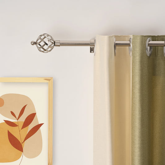 Extendable curtain rod installed in living room with stylish curtains