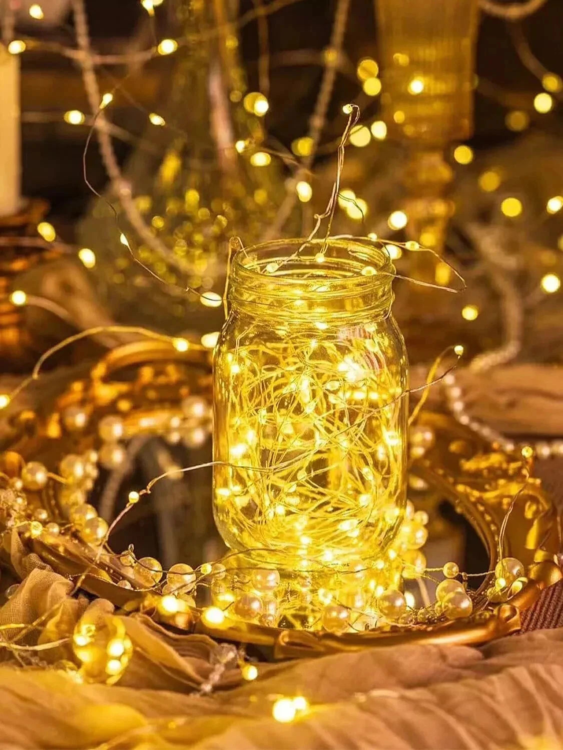 Flexible wire fairy lights wrapped around decor creating warm ambiance
