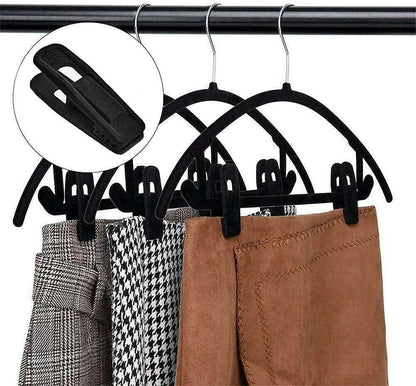 Flocked velvet trouser hangers showing strong grip clip design