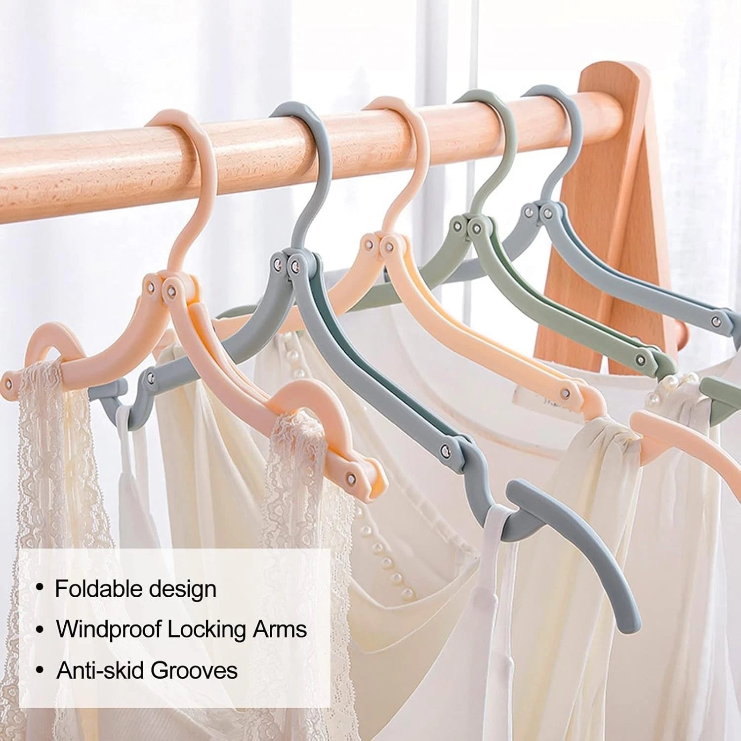 Folding clothes hanger packed inside travel luggage suitcase