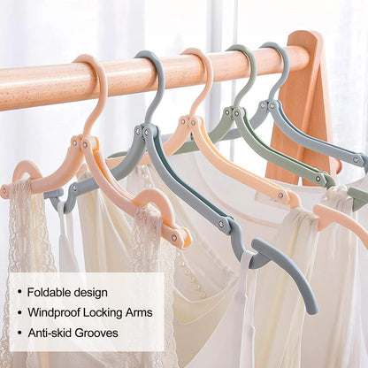 Folding clothes hanger packed inside travel luggage suitcase
