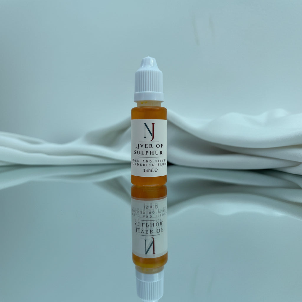 Liver of sulphur liquid used in metal art project application