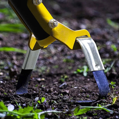 Long handle garden hoe used for weeding soil in garden bed