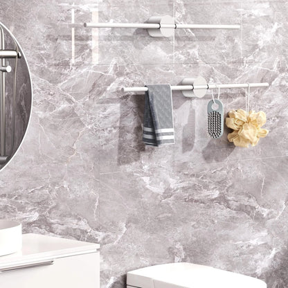 Metal hand towel holder used in kitchen for easy access