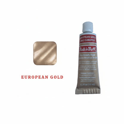 Metallic wax creating antique finish on surface