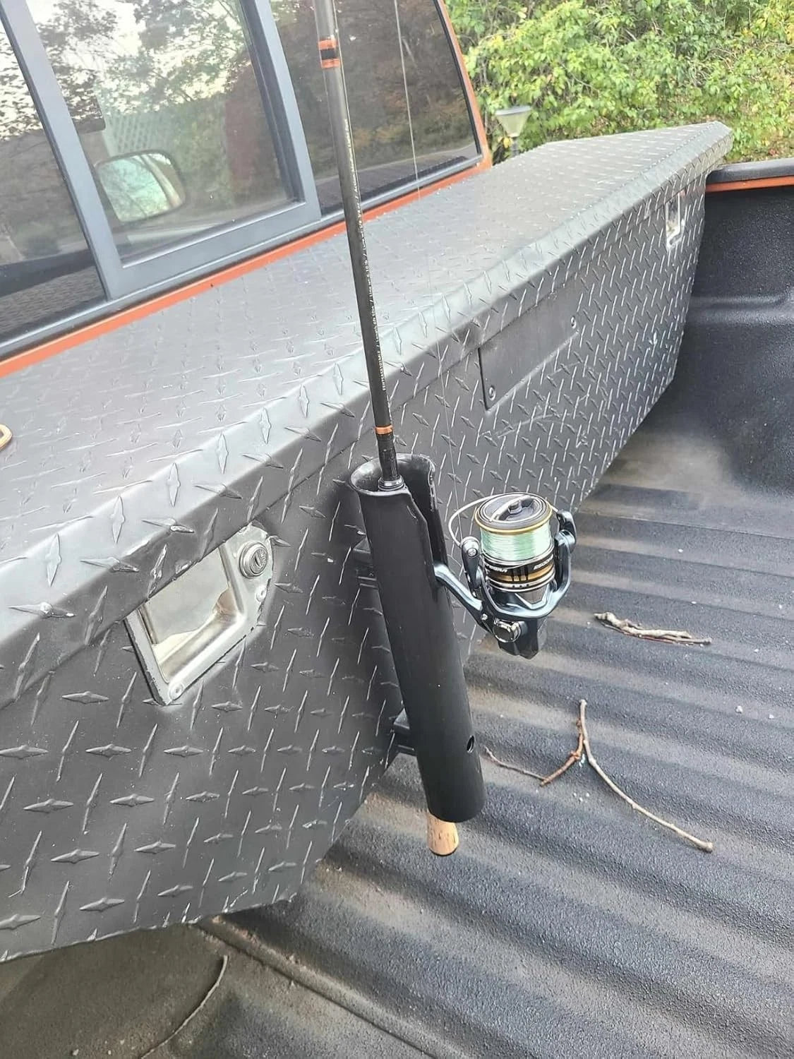 Stainless steel fishing rod holder mounted on boat or kayak rail system