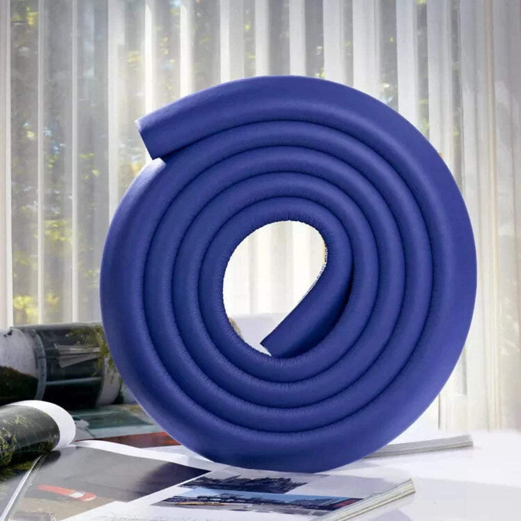 Table edge bumper protecting child from sharp corners