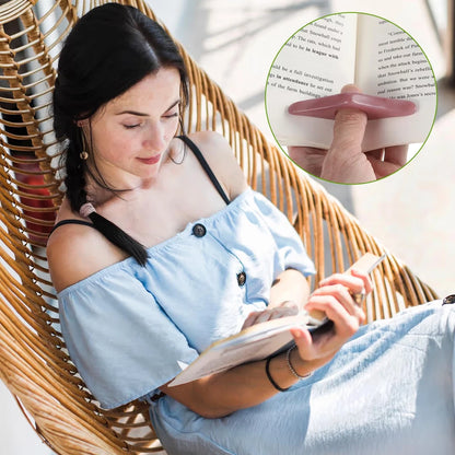Thumb bookmark reading use close-up holding pages open